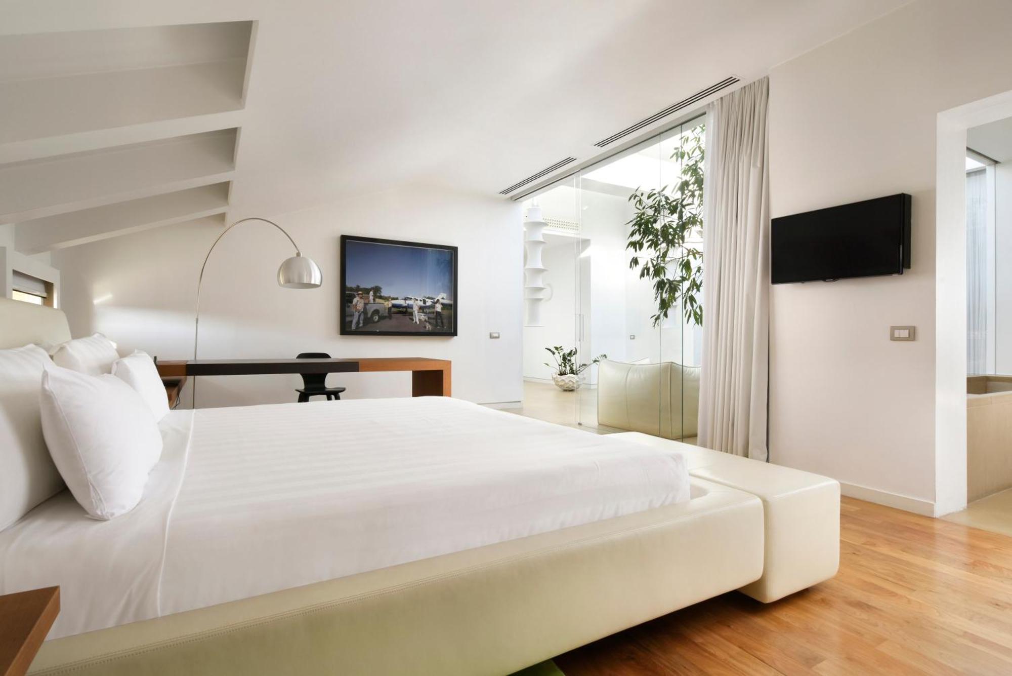 Palazzo Montemartini Rome, A Radisson Collection Hotel Bagian luar foto A room at the hotel