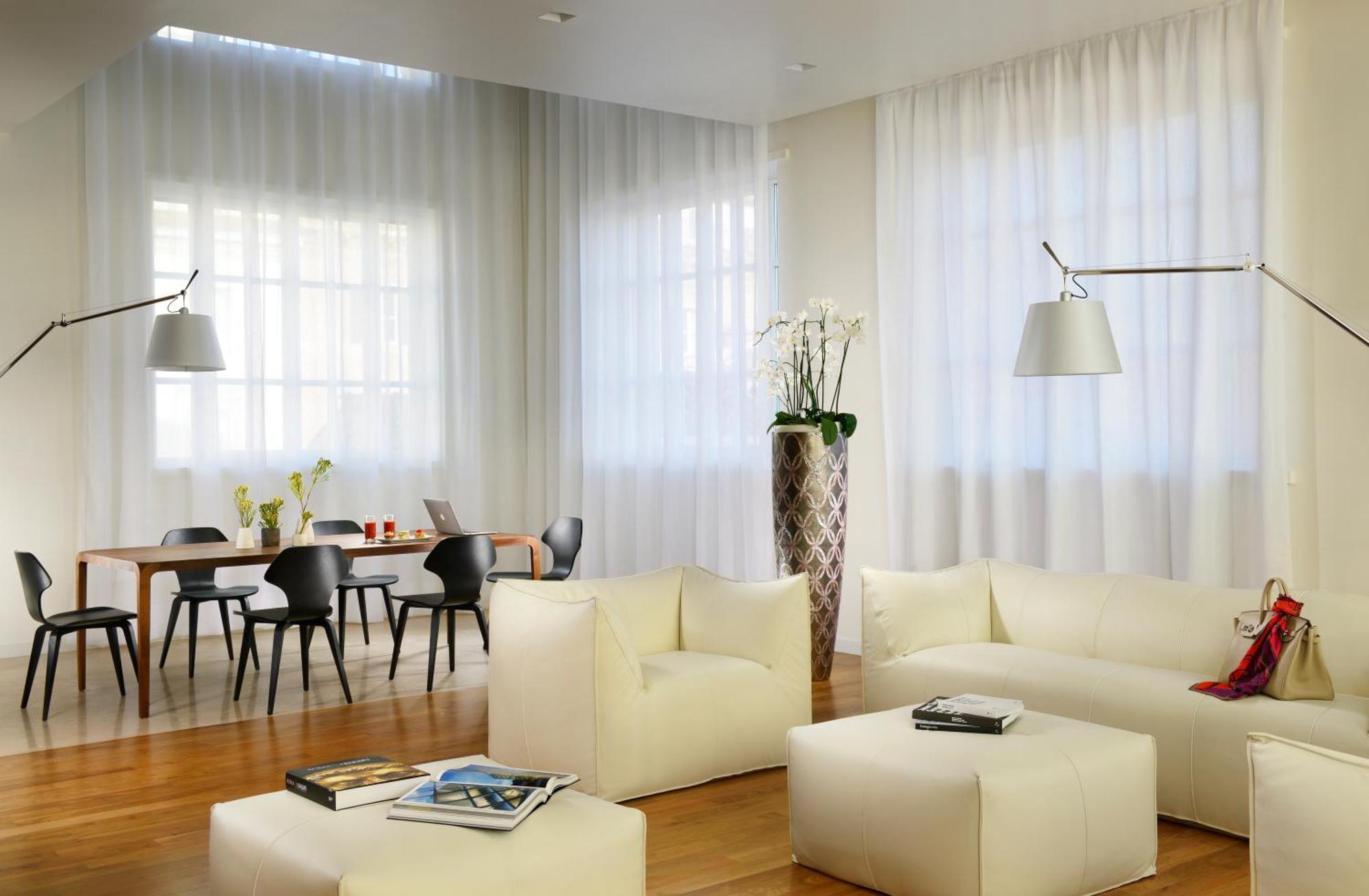 Palazzo Montemartini Rome, A Radisson Collection Hotel Bagian luar foto A living room