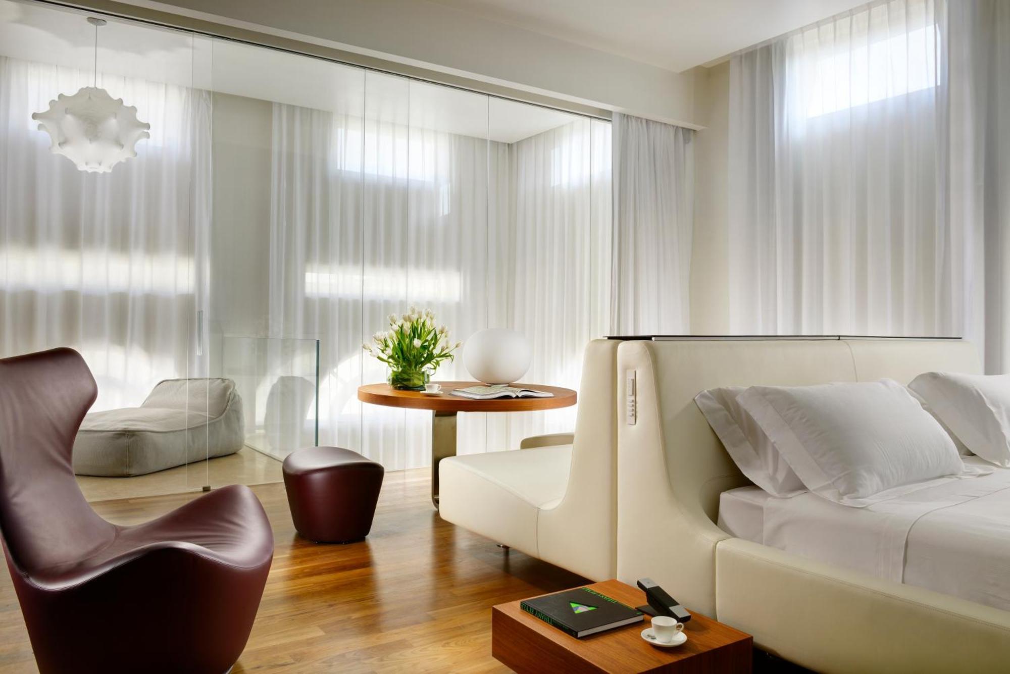 Palazzo Montemartini Rome, A Radisson Collection Hotel Bagian luar foto A room at the Mandarin Oriental, Munich